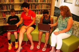 A preview: 5th graders Hunter Davis (left) and Carolina Cooper were able to get a first-hand feel for the Chromebooks when they stopped by the elementary school this summer. Show with the students is (left) 5th grade teacher Tami Clark and Intermediate Principal Karen Bullock (right).